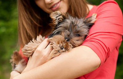 woman holding dog